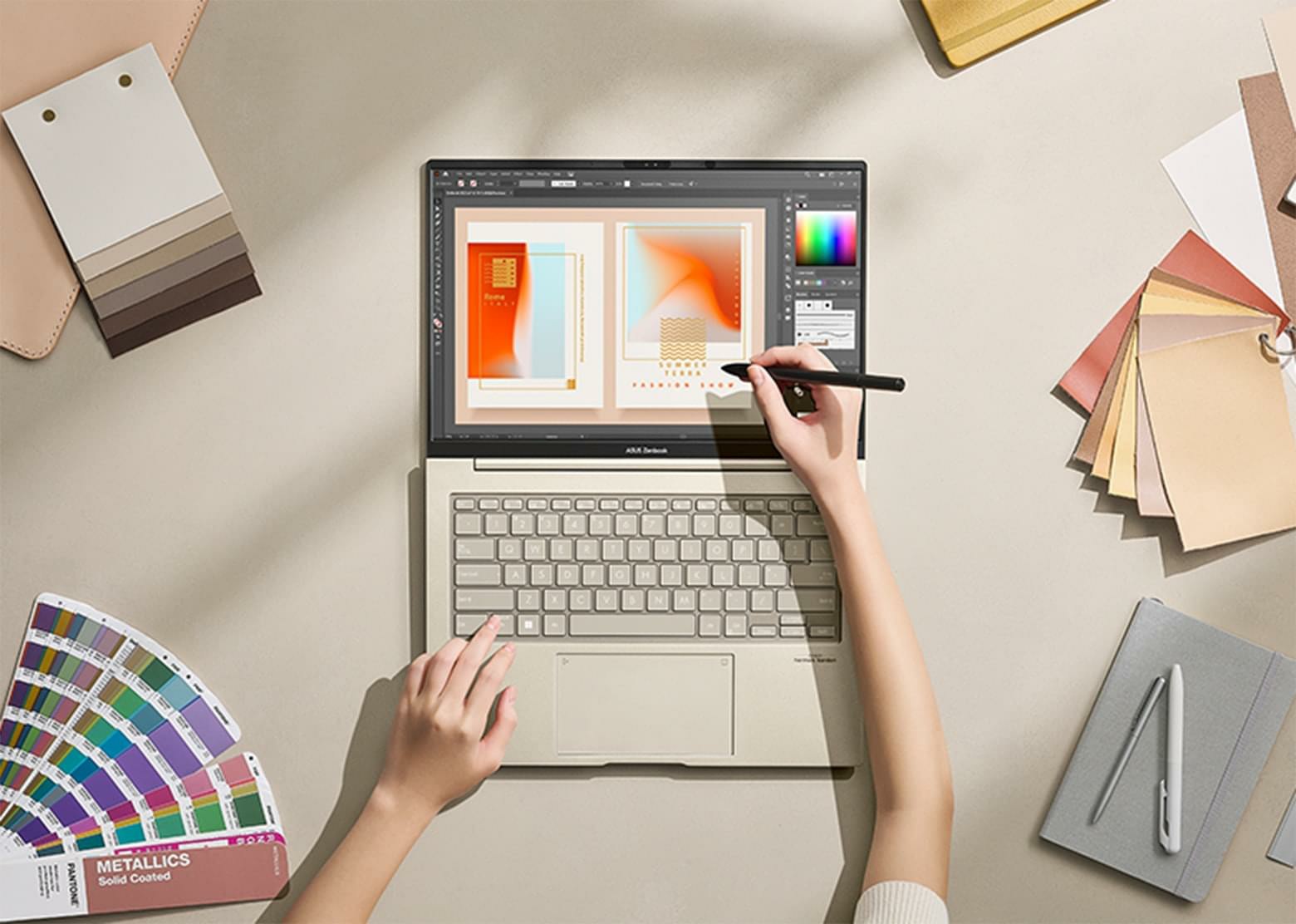 Zenbook 14X OLED được đặt trên bàn ở 180 độ với nhiều phiên bản màu sắc xung quanh. Một phụ nữ đang dùng bút stylus để làm việc trên màn hình.
